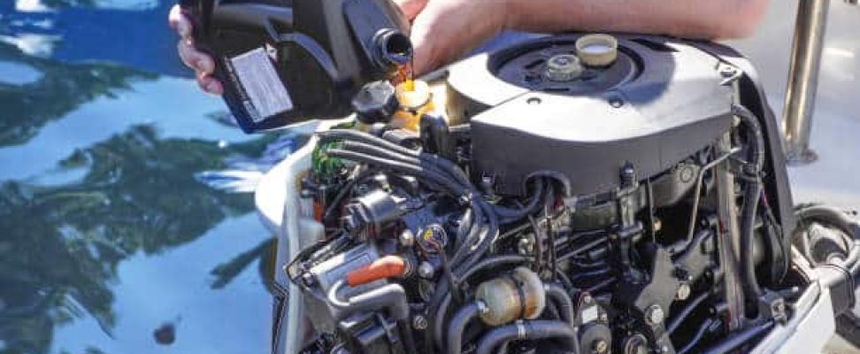 a man pouring and refueling engine motor oil into the engine for boat or yacht.